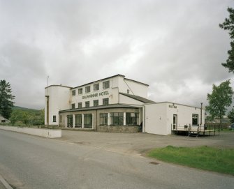 View of frontage with Bill's Bar at right from SE