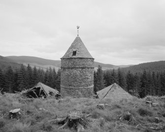 Elevated view from NW, showing the central tower and the slated roofs of its two adjacent 'pavilions'