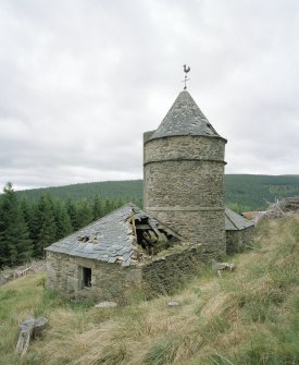 View from N, showing the central tower and wind vane, and its two adjacent 'pavilions'