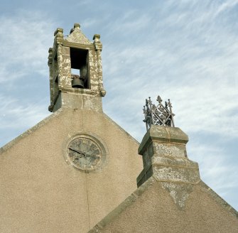 Detail of bellcote, clock and vestry finial