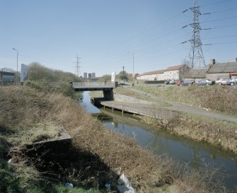 General view of Lambhill Bridge and Forth and Clyde Canal with towpath from E showing Skirsa Street housing