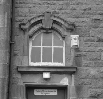 Arched window above  main entrance doorway, detail