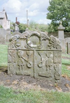 Churchyard, gravestone inscribed AB-AT, detail