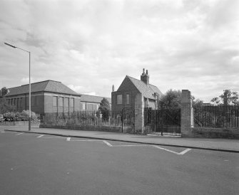 View of South gates and Janitors house from South West