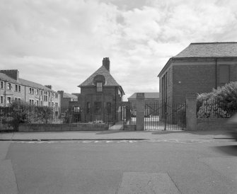 View of North gate and janitors house from West