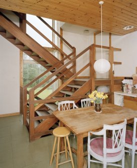 View of Kitchen from East showing open tread staircase.