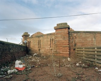 View of walls forming SW corner from E