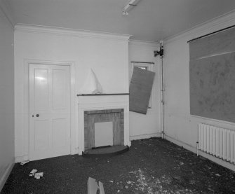 Interior view of 'living room' showing fireplace.