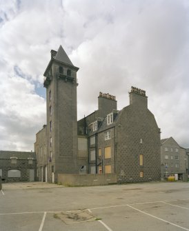 View from north east showing rear of main block, and hose-drying tower