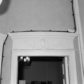 Interior. Detail of hall overdoor with portrait bust