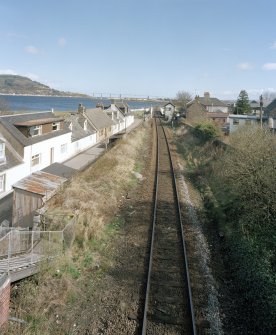 Inverness, Clachnaharry Station, Signal Box
An elevated view from the deck of the nearby footbridge over the railway, looking north-east along the track bed towards the Kessock suspension bridge in the distance.  Visible in mid picture are Clachnaharry signal box, with the railway swing bridge, sitting in the closed position over the Caledonian Canal just beyond