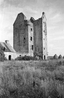 Fairburn Tower. General view from South West including cottage with kitchen fireplace on outside of East gable.