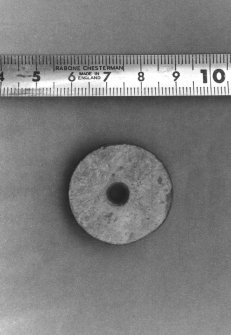 Spindle whorl from Craig Phadrig 1971 excavation. Scale in cms. In MS7262/5
