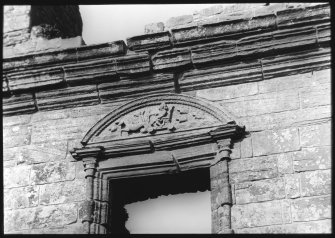 Detail of carved tympanum of window pediment.