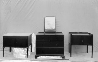 Chest of drawers with mirror and two cabinets.
