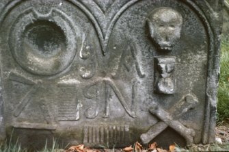 View of headstone to barber d. 1729, showing bowl, razors and combs, Alloa Old Parish Church.