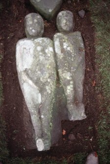 View of two carved figures, possibly Adam and Eve, Alva churchyard.