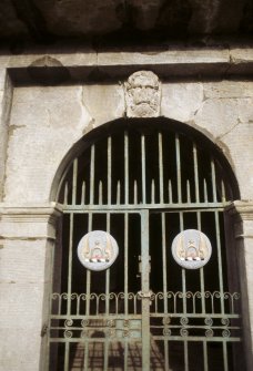 View of entrance to burial vault with green man carving on arch,  Alva churchyard.