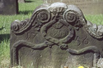 View of headstone with green man dated 1756, Alva churchyard.
