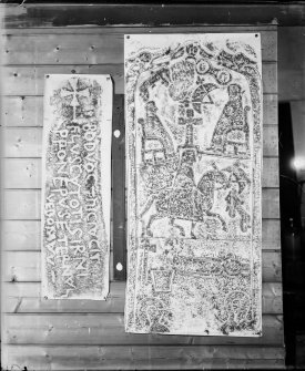 Photographic copy of two rubbings. The left rubbing is the inscribed carved stone, known as the 'Badvoc Stone', originally from Margam Mountain, now re-housed at Old School House Margam, Glamorgan, Wales. The right rubbing is the reverse of Dunfallandy Pictish cross slab.

