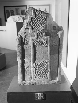 View of face of cross slab fragments, St. Vigeans no.22 and no.23, on display in St Vigeans Museum.