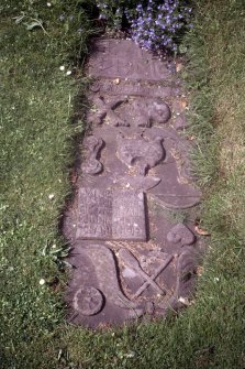 View of grave slab with baker's symbols, Logie Old Churchyard.