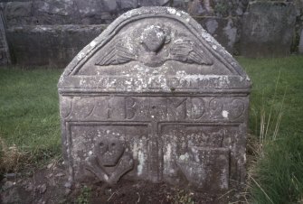 View of headstone dated 1707 with winged soul,  Logie Old Churchyard.