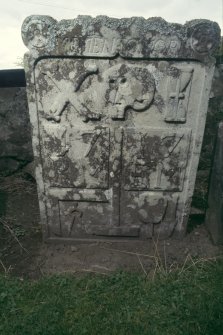 View of headstone 1717 with skull and cross bones, possibly in Logie Old Churchyard.