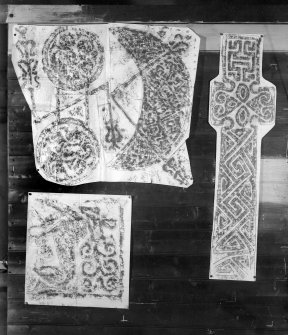 Photographic copy of three rubbings. The upper left rubbing shows the upper detail and the lower left rubbing shows the lower left detail of the reverse of Aberlemno No. 3 Pictish symbol stone, Angus. The right rubbing shows the face (b) of a cross slab from Kilmartin Churchyard, Argyll.