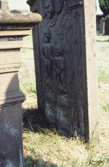 View of headstone with carving of McMonies children d. 1790-93, Kirkandrews Old Church burial ground.