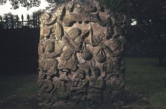 View of headstone with carved figures and scales, Alloway Old Kirkyard burial ground.