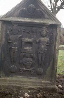 View of headstone to John and Alex McLean d. 1738 with tailor's tools, St Mary's Church burial ground, Banff.
