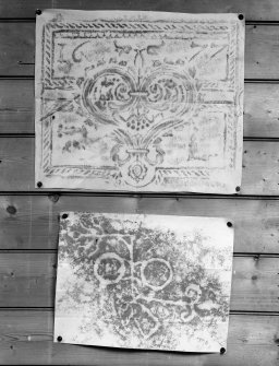 Photographic copy of two rubbings. The upper rubbing is of an unidentified panel, bearing the date 1677. The lower rubbing shows the double disc and Z-rod and beast's head Pictish symbol carvings in Doo Cave, East Wemyss.