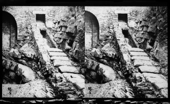 NMRS survey of Private Collections.  Stereoscopic view of an external drain with covers below Edinburgh Castle.
Copied from an original plate by Thomas Begbie taken in c.1860.