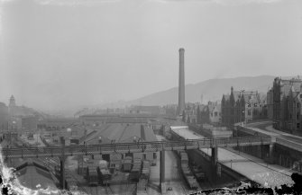 View of New Street Gasworks looking east, also showing Burns Monument and footbridge over Waverley Goods Station, Edinburgh