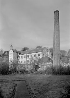 View of main building and engine house with chimneystack, Bongate Mill, Jedburgh, from south east