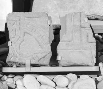 View of Drainie no. 4 and no. 21 cross slab fragments on display in Elgin Museum.