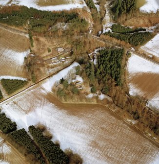 Oblique aerial view centred on the remains of the possible motte and tower-house, taken from the SSW.