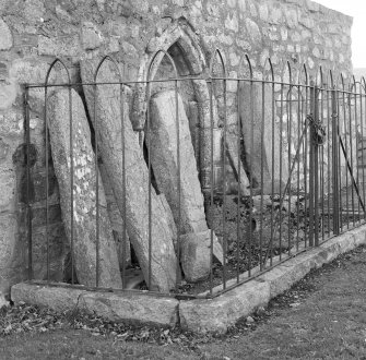View of sculptured stones in railed enclosure, St Nathalan's Kirk, Tullich.