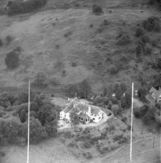 ""Covenanters Inn"", Aberfoyle, Perthshire, Scotland, 1953. Oblique aerial photograph taken facing South/West. This image was marked by Aerofilms Ltd for photo editing. 
