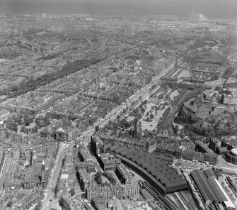 Rutland Square, Princes Street Station foreground, to Waverley and Queen Street Gardens Edinburgh, Midlothian, Scotland. Oblique aerial photograph taken facing North/East. 