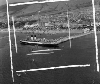Pier and Steamer Largs, Ayrshire, Scotland. Oblique aerial photograph taken facing North/East. This image was marked by AeroPictorial Ltd for photo editing.