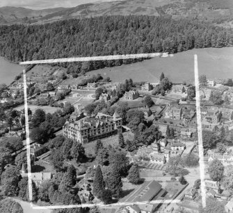 Highland Hotel, Transit Families Camp (CO May Stewart) Fodderty, Ross And Cromarty, Scotland. Oblique aerial photograph taken facing North/West. This image was marked by AeroPictorial Ltd for photo editing. Note also the Pump Room for the Strathpeffer Spa in the middle foreground. These buildings have been demolished.