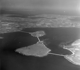 Causeways connecting Orkney mainland, with Burray via Lamb Holm and Glims Hold South Ronaldsay, Orkney, Scotland. Oblique aerial photograph taken facing North/East. 