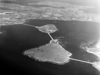 Causeways connecting Orkney mainland, with Burray via Lamb Holm and Glims Hold South Ronaldsay, Orkney, Scotland. Oblique aerial photograph taken facing North/East. 