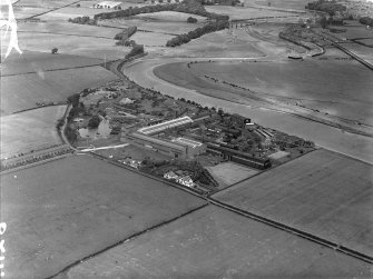 General View, Cochran and Co Annan Ltd. Newbie, Dumfries and Galloway, Scotland. Oblique aerial photograph taken facing North.