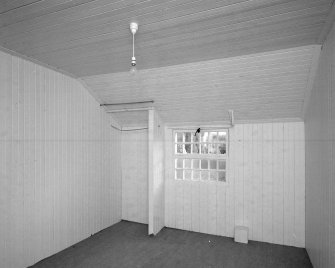 Interior. Tin House, view of a timber lined ground floor room