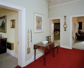 View of second floor hall, showing speaking tube and collection paddle