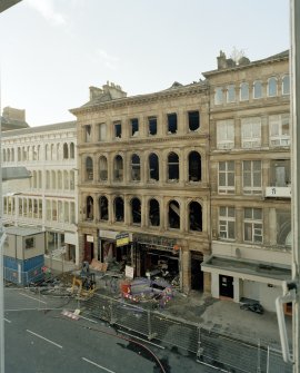 Elevated view of entrance front from third floor window of building to NE