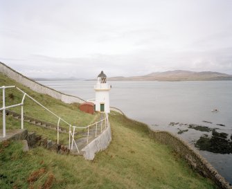 Islay, McArthur's Head Lighthouse
View from S within compound, showing steps down to lighthouse, the compound wall, and the Sound of Islay in the background, with Jura also visible across the water